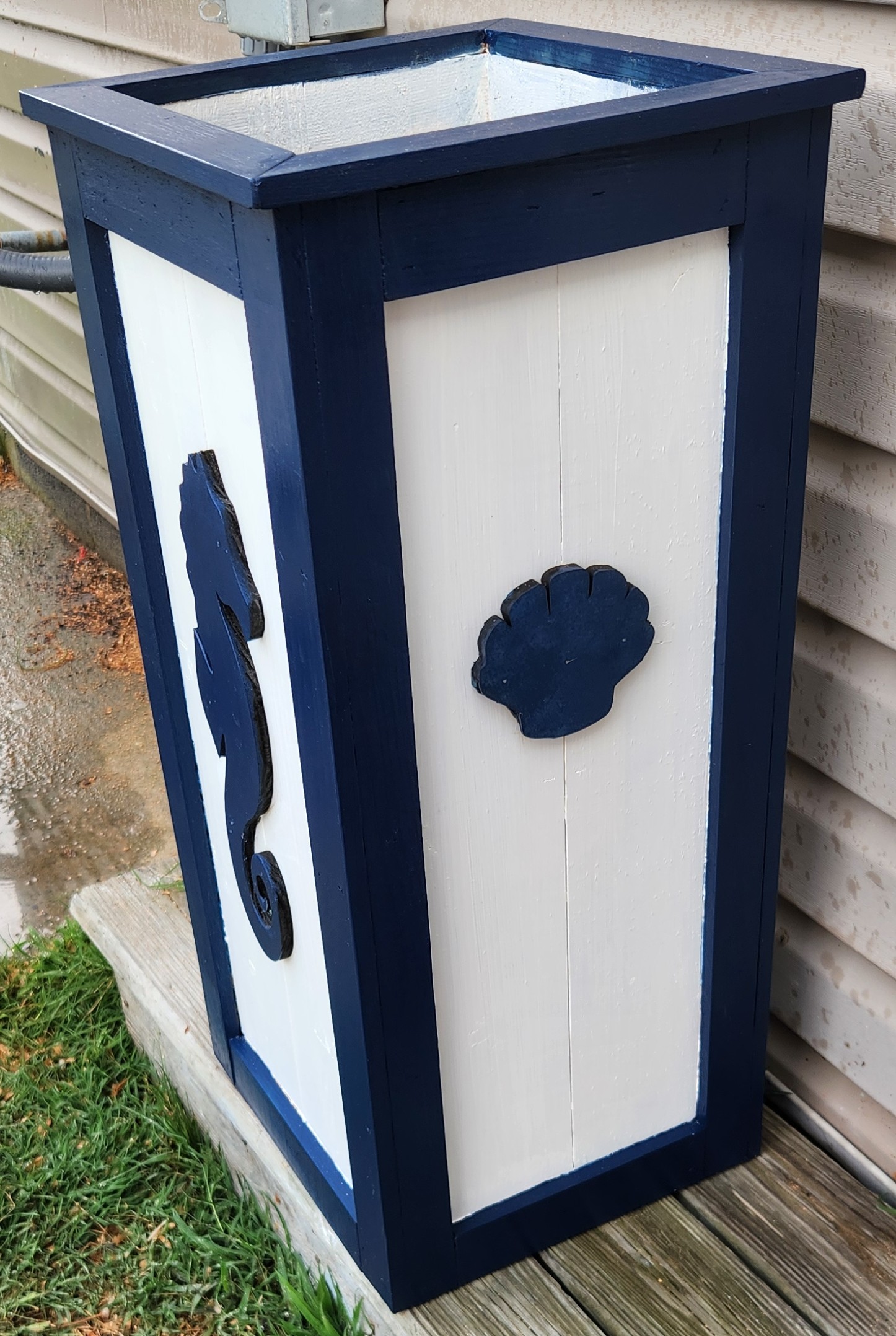 Left side of our Seahorse Tall Boy 28.5"H x 14 Square top, Exterior stained and Custom Cutouts attached